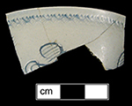 Scratch blue cup with floral motif, recovered from cellar hole dating to mid-18th century, lots 33, 49.